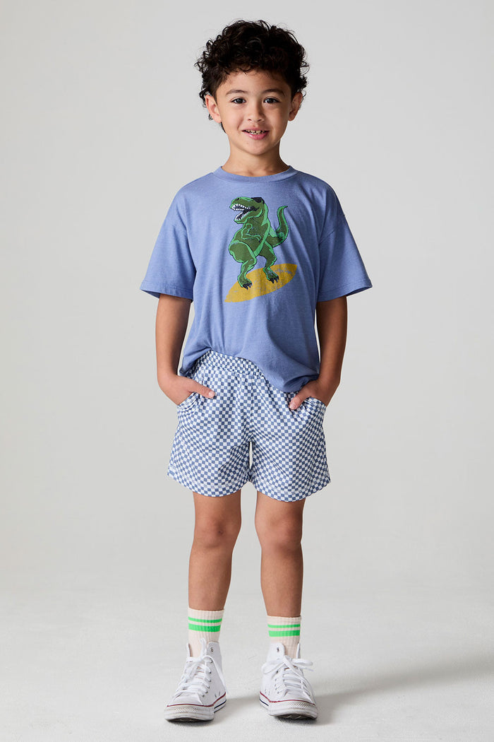 A full body front view of a boy wearing the Chaser  Cozy Beach Short on a neutral background