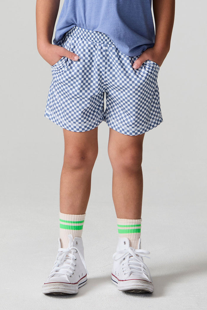 Front view of a boy wearing the Chaser  Cozy Beach Short on a neutral background