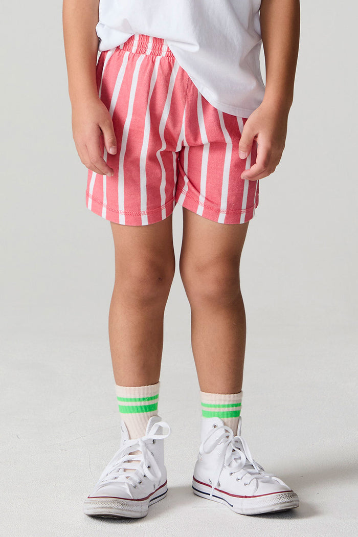 Front view of a boy wearing the Chaser Cozy Sungraze Stripe Beach Short on a neutral background