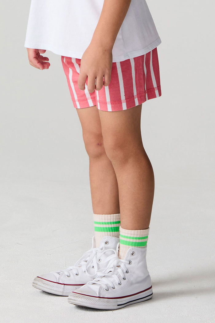 Side angle view of a boy wearing the Chaser Cozy Sungraze Stripe Beach Short on a neutral background