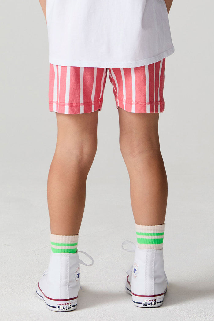 Back view of a boy wearing the Chaser Cozy Sungraze Stripe Beach Short on a neutral background