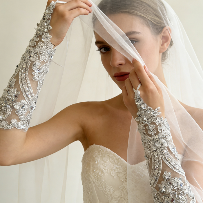 Rhinestone pearl beaded bridal gloves with crystal embroidery for an elegant wedding dress accessory.