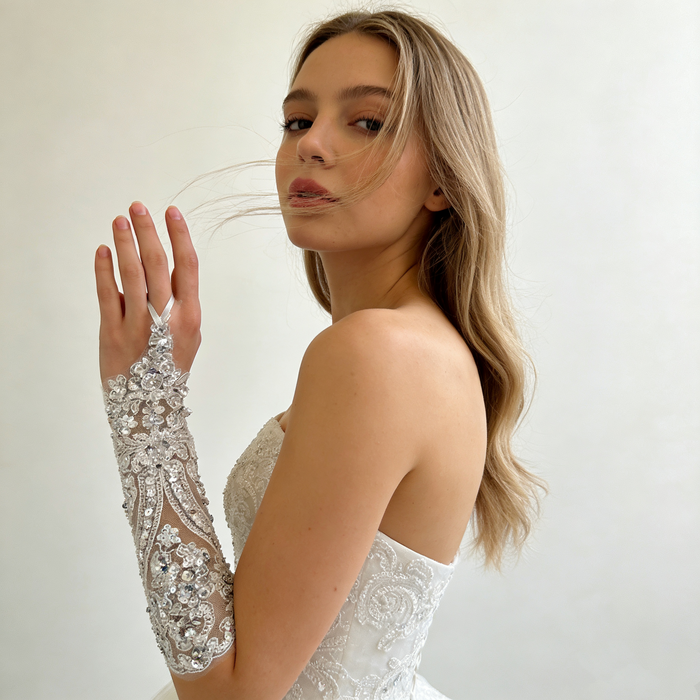 Rhinestone pearl beaded bridal gloves with crystal embroidery for an elegant wedding dress accessory.