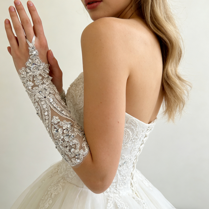 Rhinestone pearl beaded bridal gloves with crystal embroidery for an elegant wedding dress accessory.