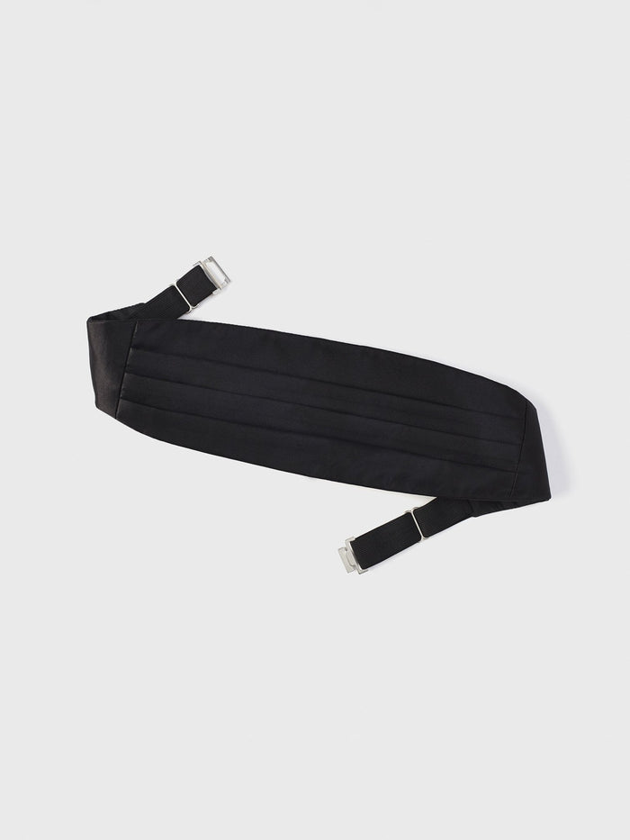 Black silk cummerbund with horizontal pleats, laid flat with buckle straps at each end.