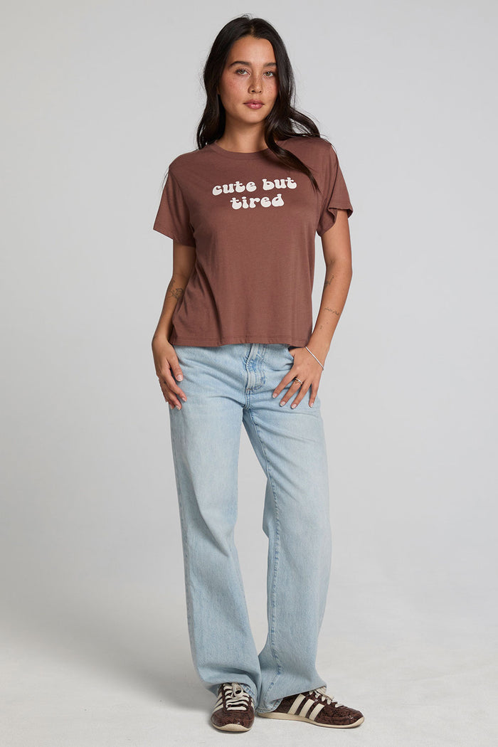 A full body front view of a woman wearing the Chaser Cute Buttired Top on a neutral background