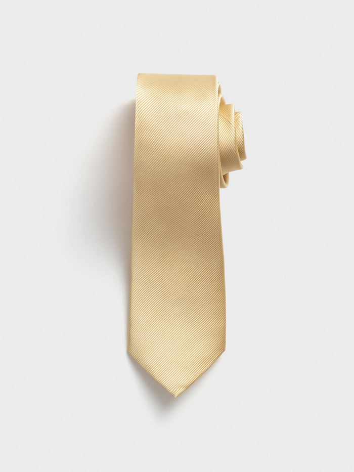 Daffodil silk necktie with twill texture, rolled at the top, on a grey background.