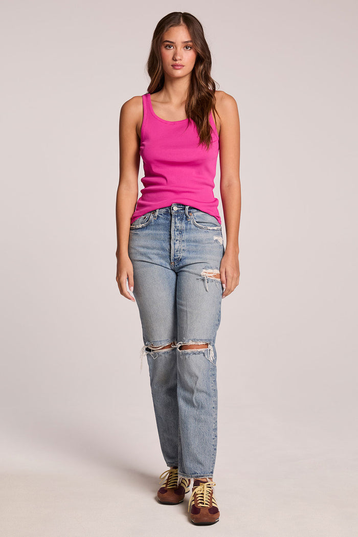 Front full body view of a woman wearing the Chaser   Daphne Electric Fuchsia Tank Top and sneakers on a neutral background