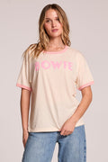 Front view of a woman wearing the Chaser  David Bowie Santa Monica '72 Tee and jeans on a neutral background