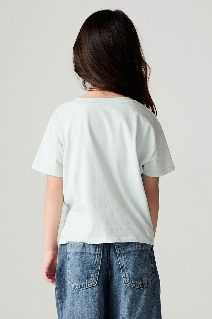 Back view of a girl wearing the Chaser David Bowie Stars Bowie Girls Tee on a neutral background with jeans