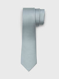 Deep sage grey-green silk necktie rolled into a loose coil on a grey background.