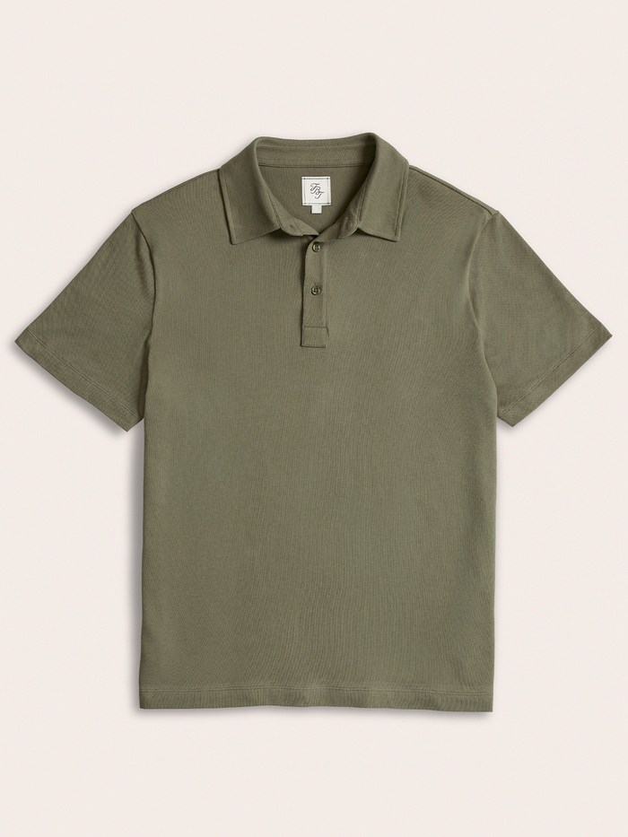 Olive green pique polo shirt laid flat, front view, on cream background