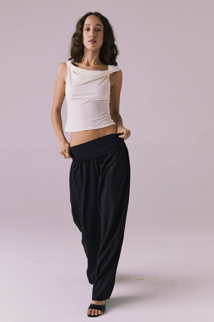 Full body shot of the Chaser Didion Licorice Black Trousers shown with the Roxanne Starry White Tank and black heeled sandals