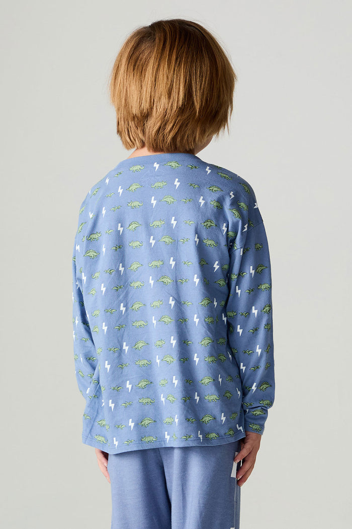 Back view of a boy wearing the Chaser Dino Bolts Boys Tee on a neutral background with pants