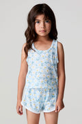 Front view of a girl wearing the Chaser Ditsy Daisies Tank and matching shorts on a neutral background