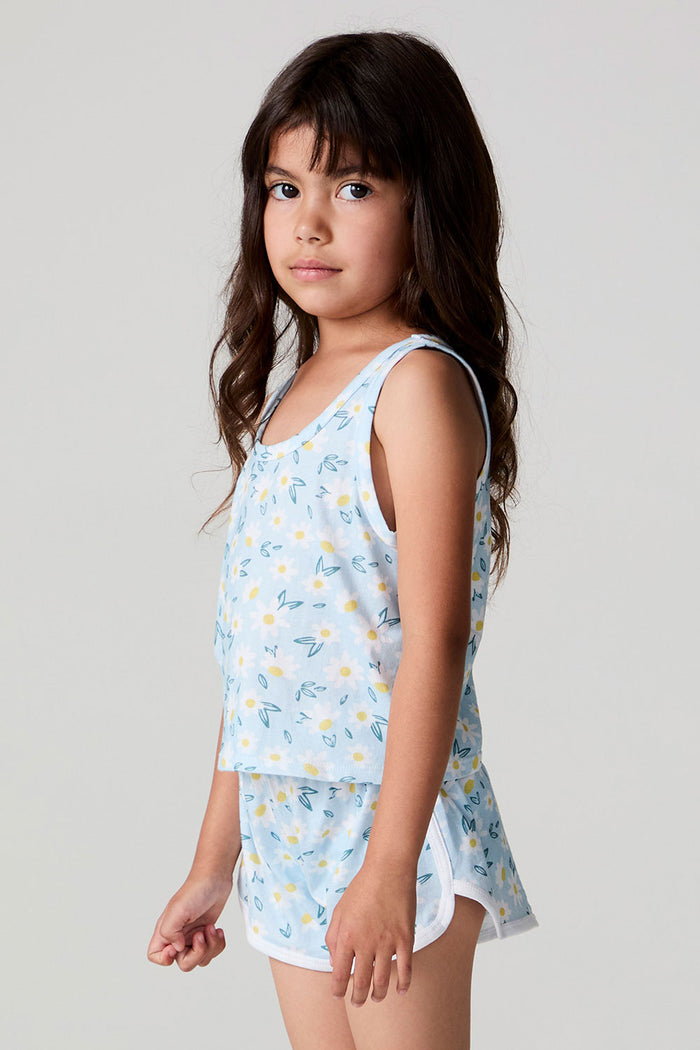 Side view of a girl wearing the Chaser Ditsy Daisies Tank and matching shorts on a neutral background