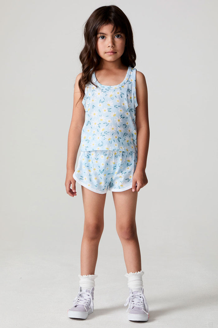 Full body front view of a girl wearing the Chaser Ditsy Daisies Tank and matching shorts on a neutral background