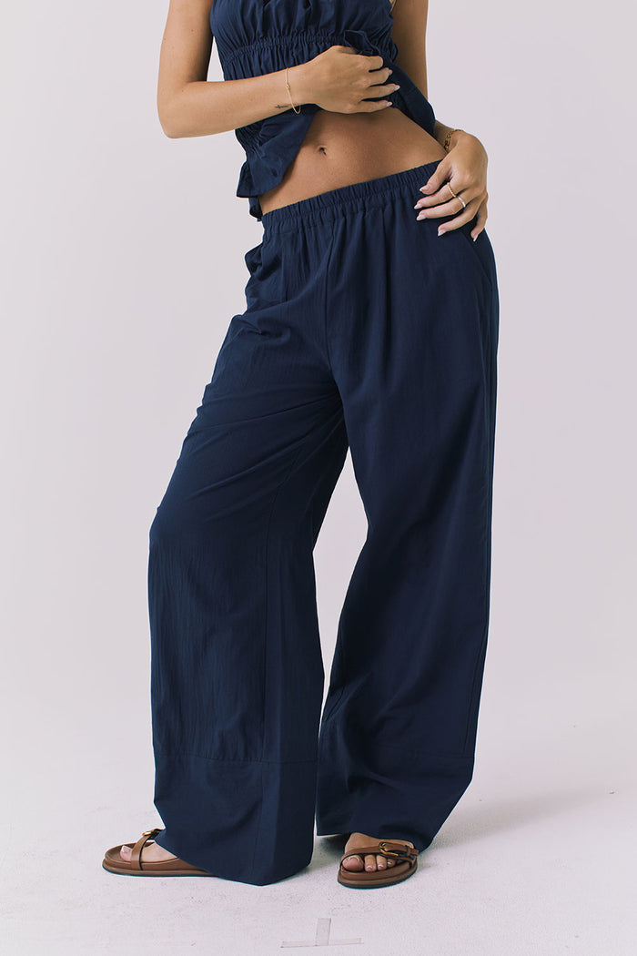 Chaser Dorit Trousers in Navy shown from the front featuring a relaxed wide leg silhouette and elastic waistband
