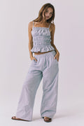 Full body view of the Chaser Dorit Pinstripe Trousers styled with the matching Lorenzo Tank and flat sandals for an effortless warm weather set look