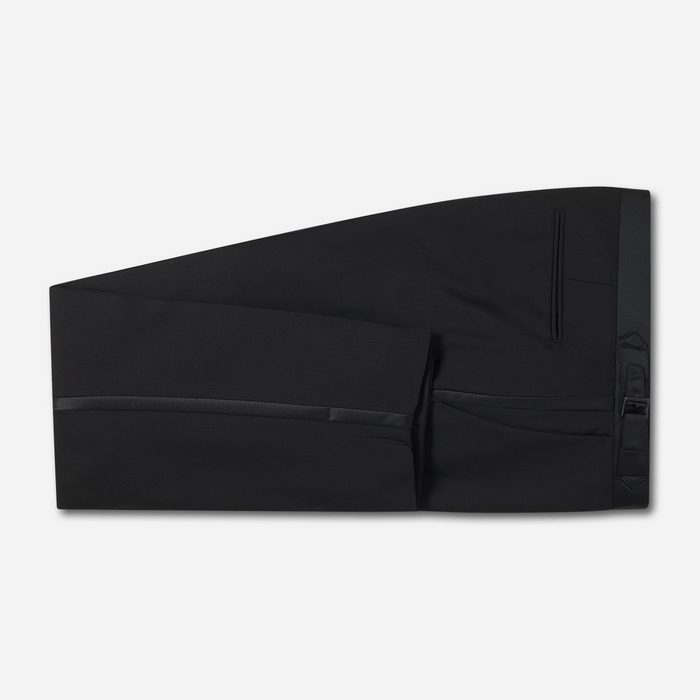 Black tuxedo trousers folded flat, showing satin side stripe and side pocket.
