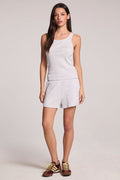 A full body front view of a woman wearing the Chaser Durango Light Heather Grey Shorts and matching top on a neutral background