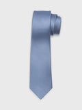 Dusty blue silk necktie with a diagonal twill weave, rolled at the top.