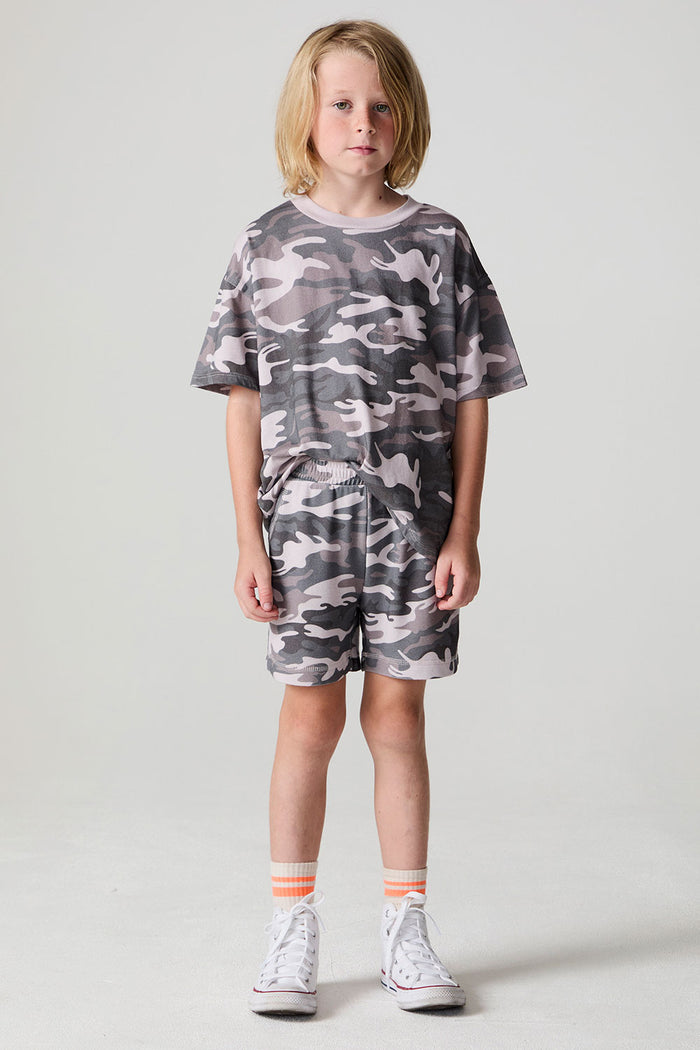 Full body front view of a boy wearing the Chaser Dusty Camo Shorts on a neutral background