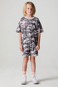 Full body front view of a boy wearing the Chaser Dusty Camo Shorts on a neutral background