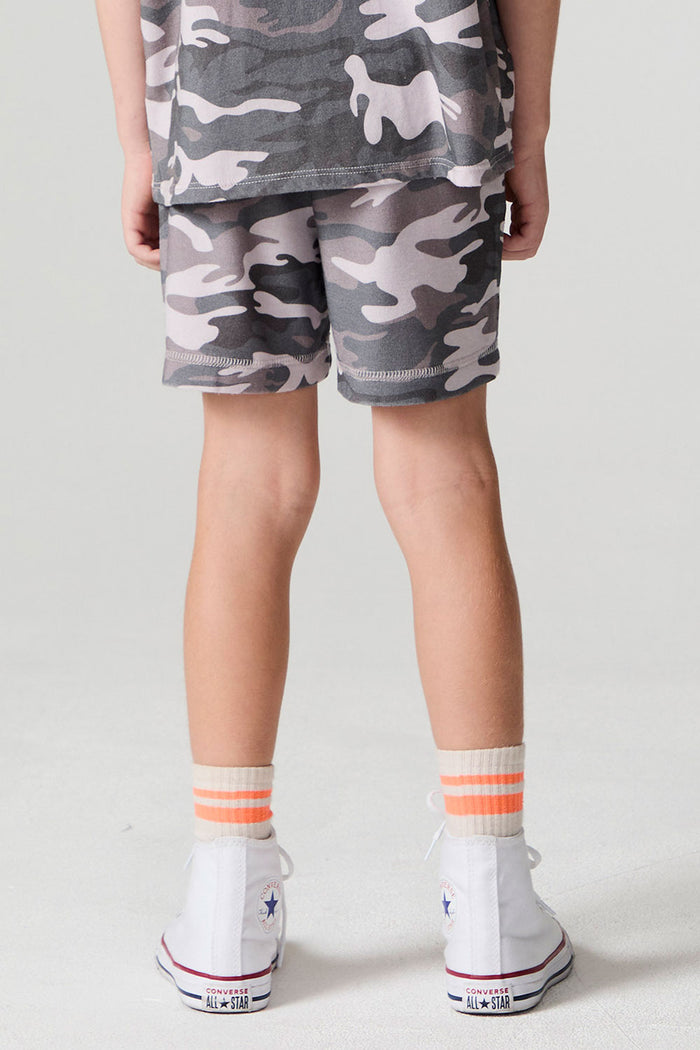 Back view of a boy wearing the Chaser Dusty Camo Shorts on a neutral background