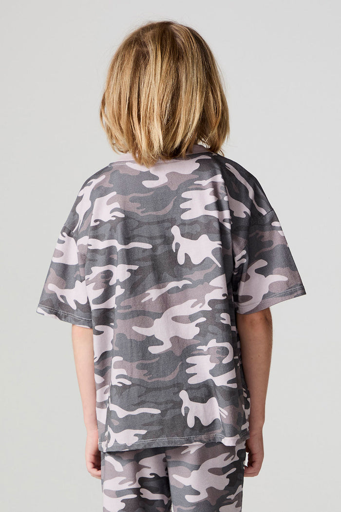 Back view of a boy wearing the Chaser Dusty Camo Tee  on a neutral background