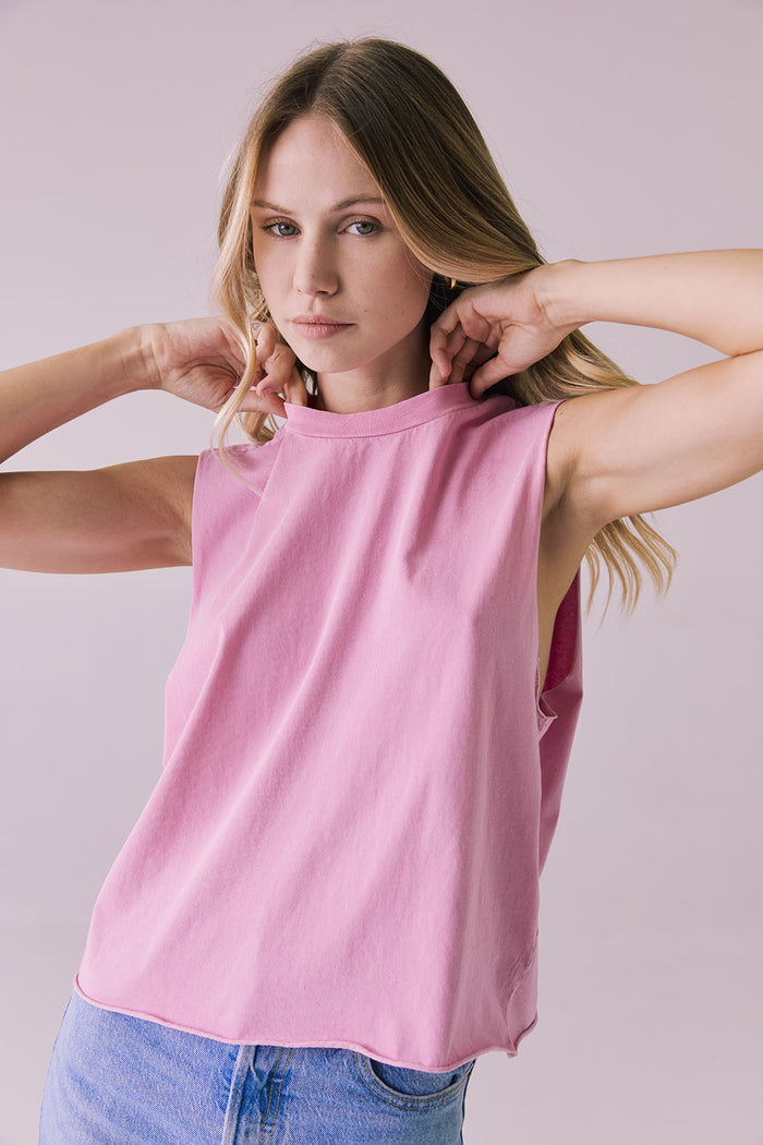 Close-up of the Chaser Eagle Bubblegum Tank showcasing the soft cotton fabric and sleeveless muscle cut in bright pink