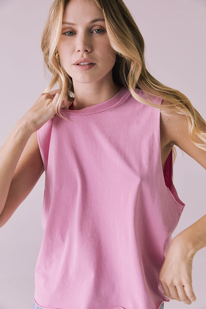 Close-up of the Chaser Eagle Bubblegum Tank showcasing the soft cotton fabric and sleeveless muscle cut in bright pink
