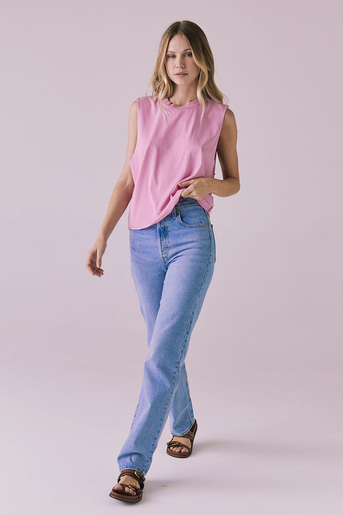 Full-body studio image of the Chaser Eagle Bubblegum Tank paired with straight-leg jeans and sandals for a laid-back everyday vibe
