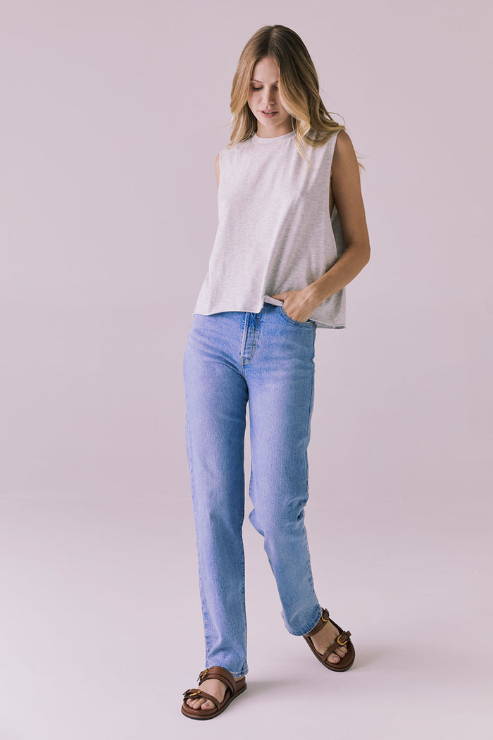 Full-body studio image of the Chaser Eagle Light Heather Grey Tank styled with light-wash jeans and brown sandals