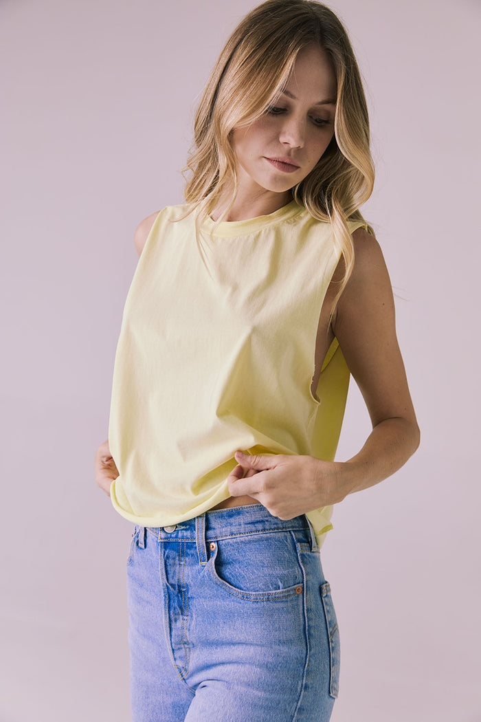 Side angle of the Chaser Eagle Panna Cotta Tank showing the dropped armhole and effortless drape