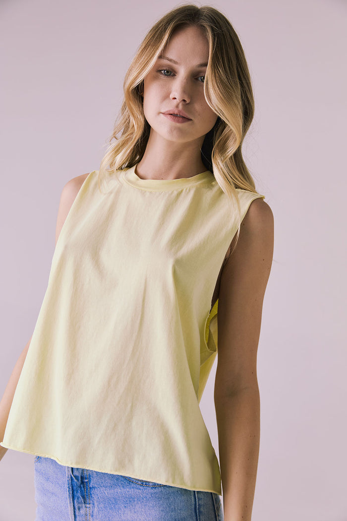 Side angle of the Chaser Eagle Panna Cotta Tank showing the dropped armhole and effortless drape