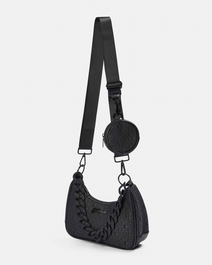 Black textured handbag with a matching round coin purse on a white background