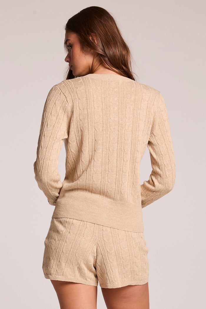 Back view of a woman wearing the Chaser Eliza Khaki Cardigan on a neutral background