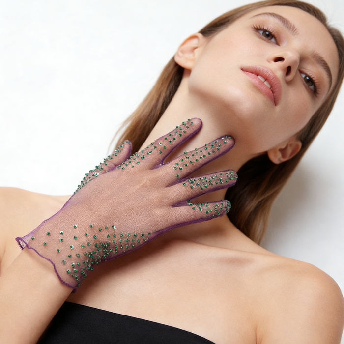 Purple illusion tulle bridal gloves with hand embellished emerald green crystal details and sheer elegant design.