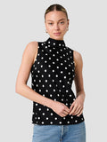 A woman wearing a eco blend satin black and white Top with a polka dot pattern, a high neckline, an invisible back zip fastening and a sleeveless regular fit.