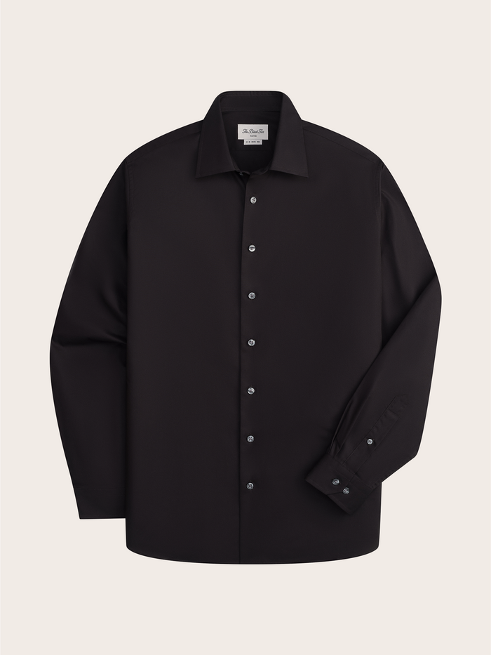 Black dress shirt laid flat, front view, showing spread collar and button placket.