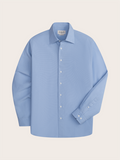 Light blue dress shirt laid flat, front view, showing spread collar and button placket.