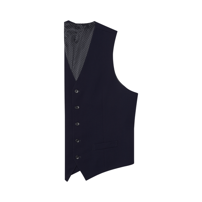 True navy suit vest laid flat, side angle showing buttons and polka-dot lining.