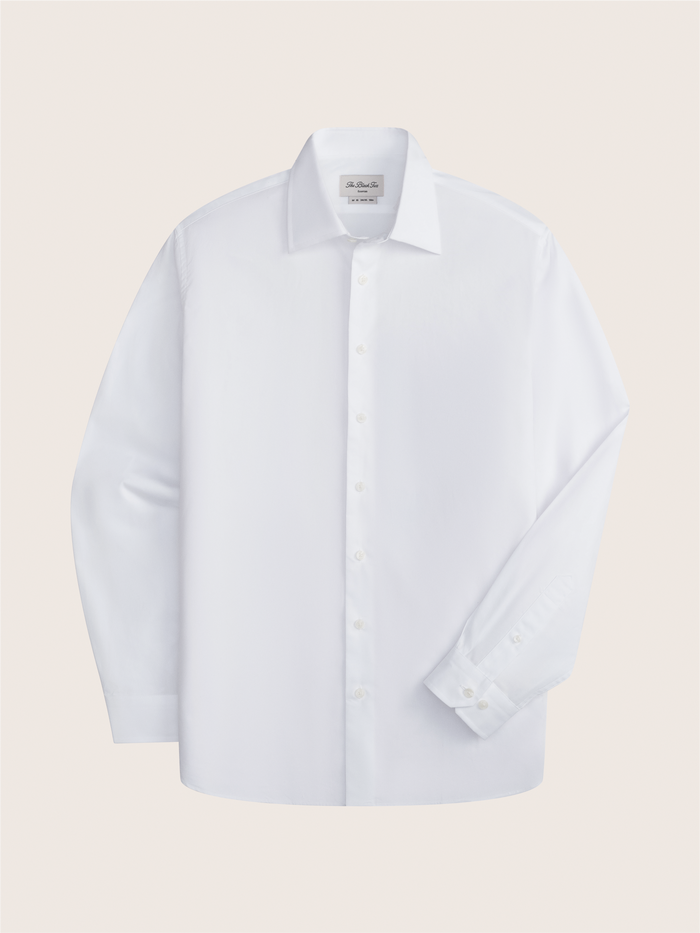 White dress shirt laid flat, front view with spread collar.