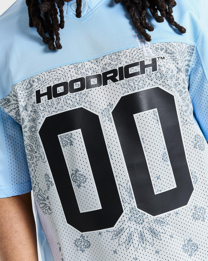 Close-up of a sports jersey with 'Hoodrich' branding and number '00'.