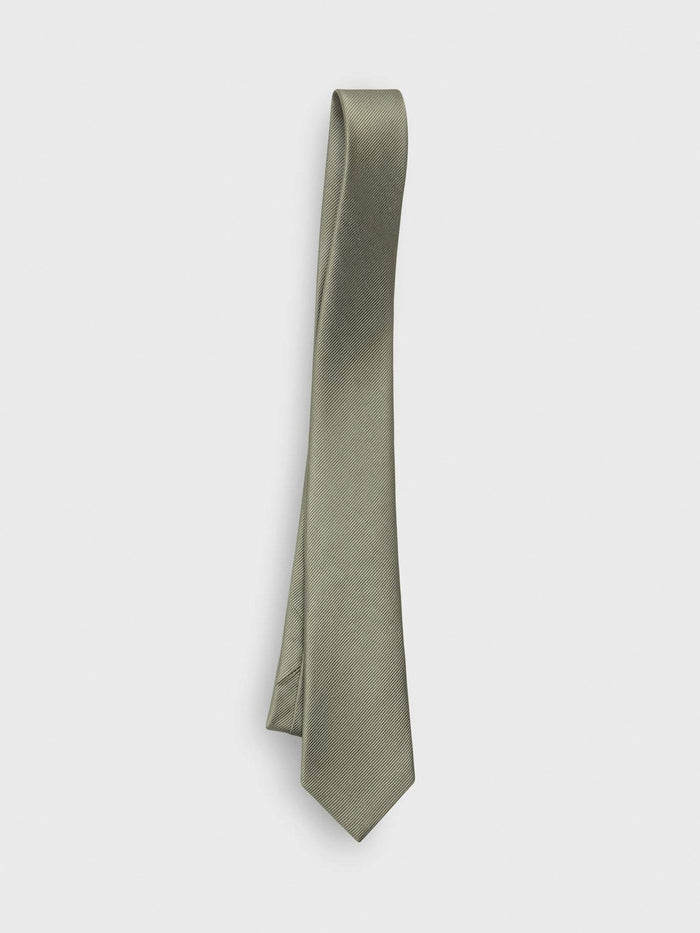 Eucalyptus silk necktie with twill texture, draped diagonally on a grey background.