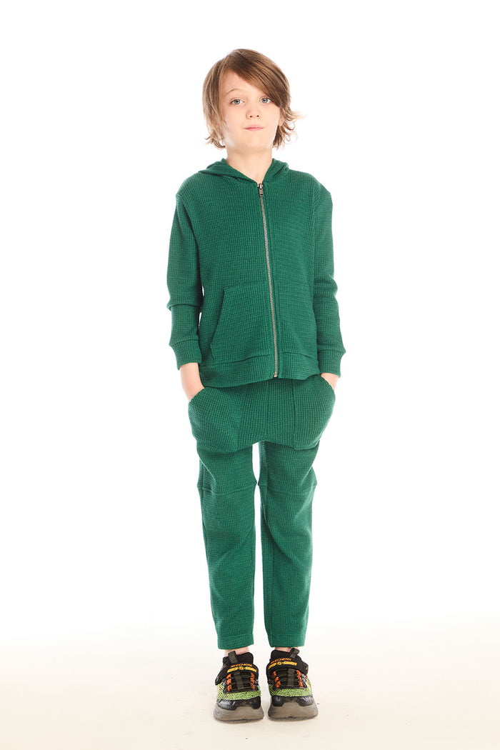 Full body front view of boy wearing Chaser’s Everest Green Knee Seam Jogger with matching Everest Green hoodie on a white background