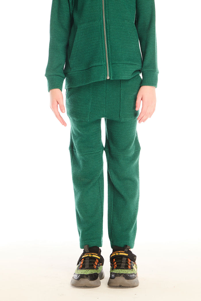 Front view of boy wearing Chaser’s Everest Green Knee Seam Jogger with knee seam detail on a white background