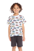 Boy wearing the Chaser Kids Fast Cars Tee in white with all-over colorful car graphics on a white background