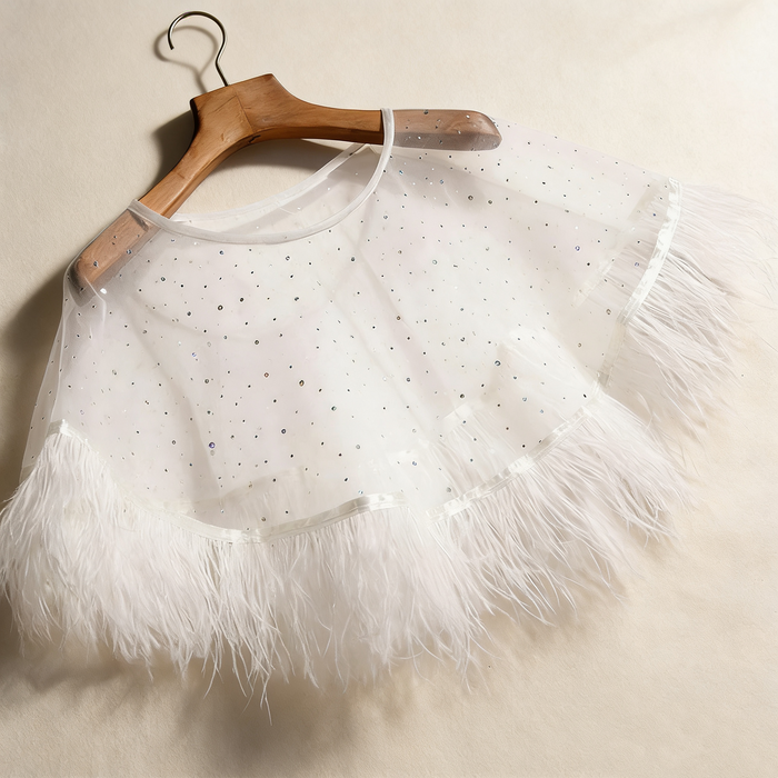 Feather bridal cape crafted from sheer chiffon with crystal embellishments and soft feather trim for wedding styling.